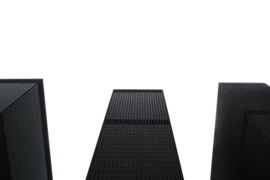 Three dark skyscrapers reaching towards the sky